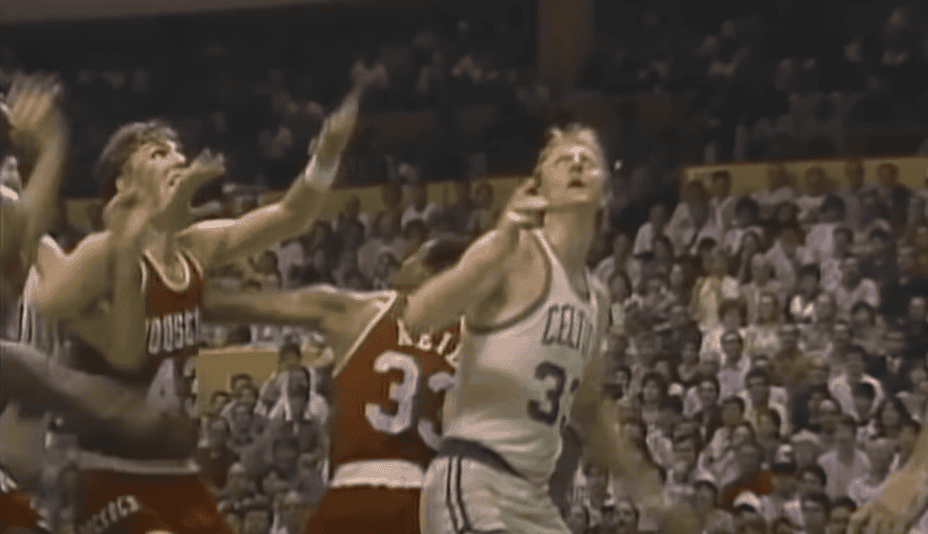 Larry Bird playing basketball on court