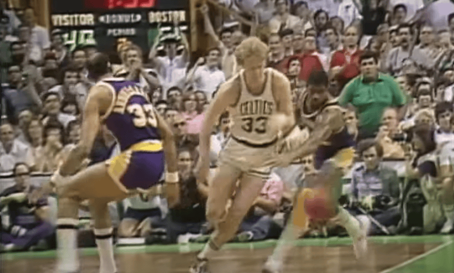 Larry Bird playing basketball on court