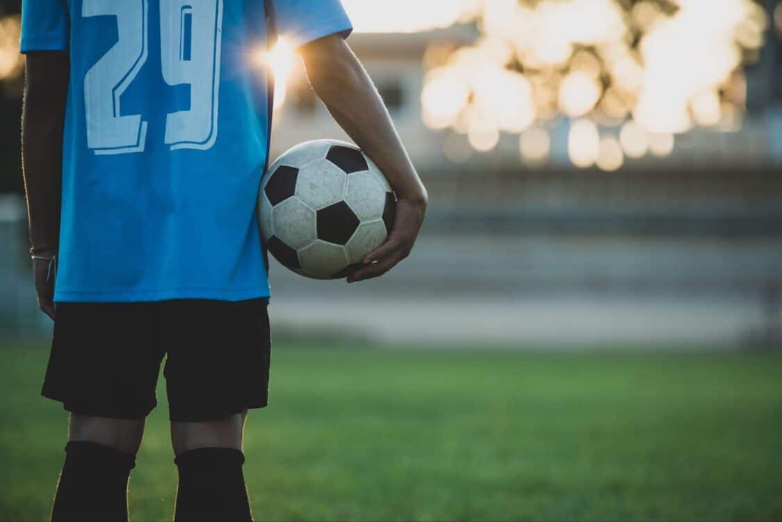 A man holding a football ball