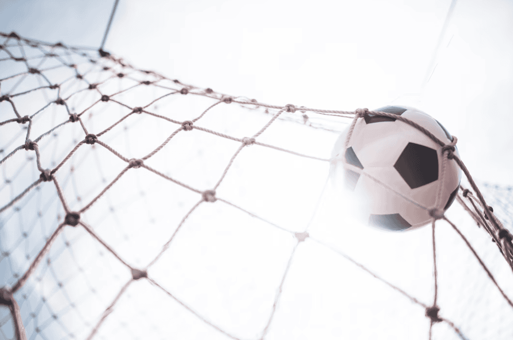 close-up view of football net and black and white ball