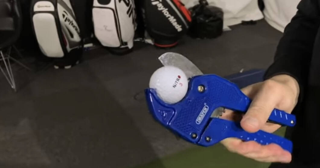 Golf ball in wire cutters